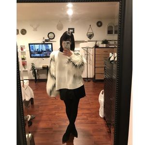 White faux fur sleeve sweatshirt.